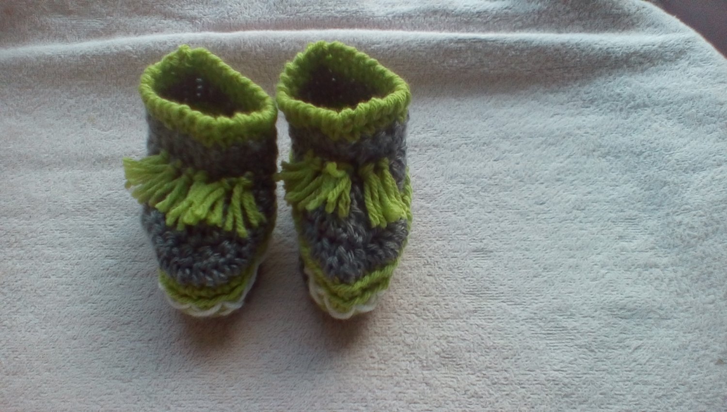 Newborn two toned light green, and gray moccasins
