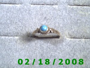 .925 Silver Ring size 9 w/light blue stone