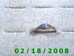 .925 Silver Ring size 9 w/light blue stone