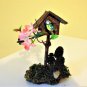 Birdhouse with titmouse bird.