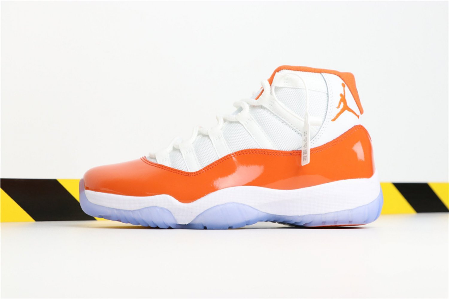 orange and white jordans 11