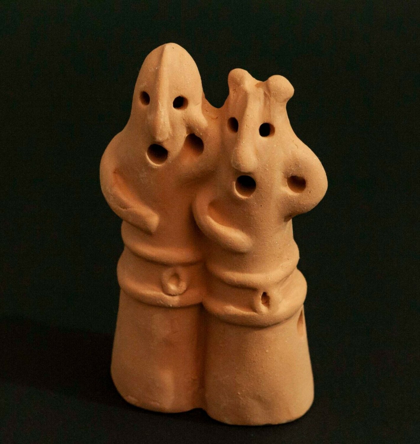 dancing clay figures