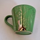 Tinkerbelle green coffee mug with gold graphic Disney