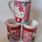 Hello Kitty Christmas themed mugs 2 patterns 14.95 Each presents mouse teddy