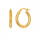 14k Yellow Gold Diamond Cut Textured Oval Hoop Earrings. D39337605