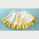White yellow mini skirt with embroidered flowers and satin ruffle. Size S