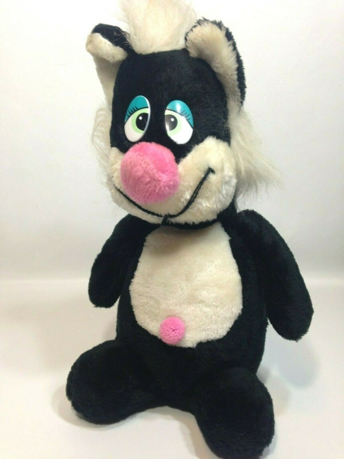 plush black cat with green eyes