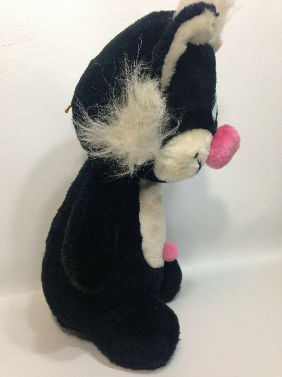 plush black cat with green eyes