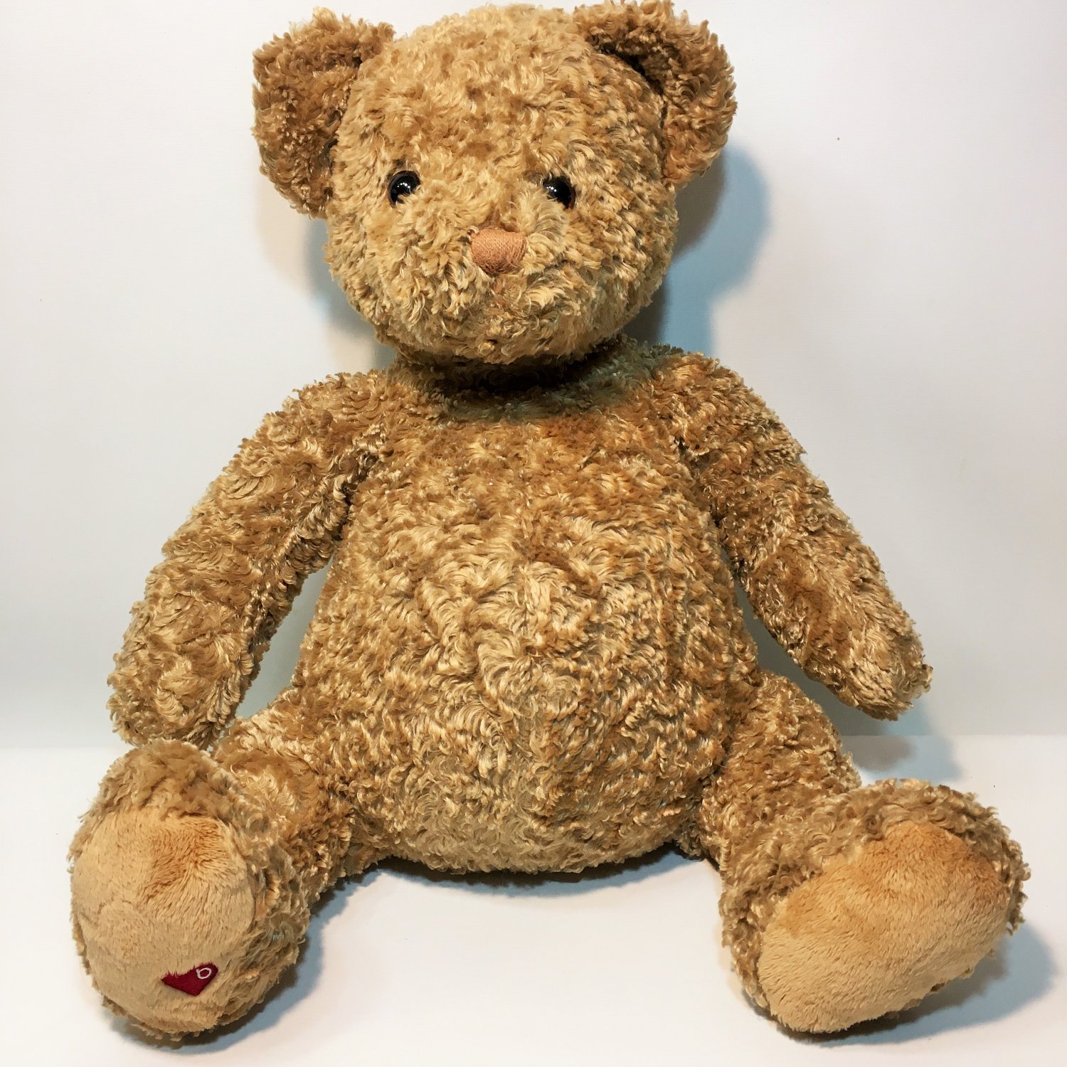 small stuffed brown bear