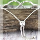 CRAVE SILVERTONE TEXTURED INFINITY BOLO BRACELET