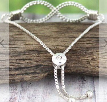 CRAVE SILVERTONE TEXTURED INFINITY BOLO BRACELET