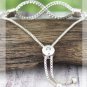 CRAVE SILVERTONE TEXTURED INFINITY BOLO BRACELET