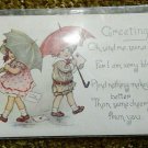Greeting with 2 Children with Umbrellas  Divided Back Postcard Not Posted