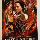 The Hunger Games: Catching Fire cast signed autographed photo photograph Jennifer Lawrence The Hunger Games: Catching Fire cast signed autographed photo photograph Jennifer Lawrence