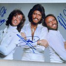 Bee Gees full band signed autographed 8x12 photo Barry Gibb Maurice Robin autographs Bee Gees full band signed autographed 8x12 photo Barry Gibb Maurice Robin autographs