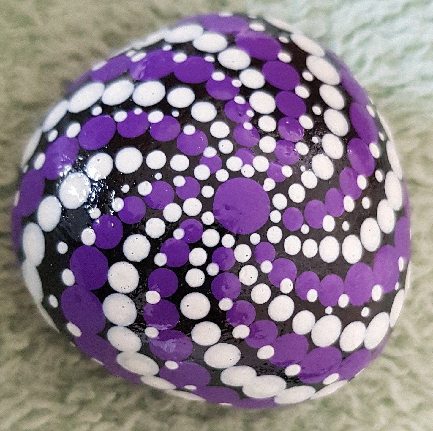 Purple and white painted rock