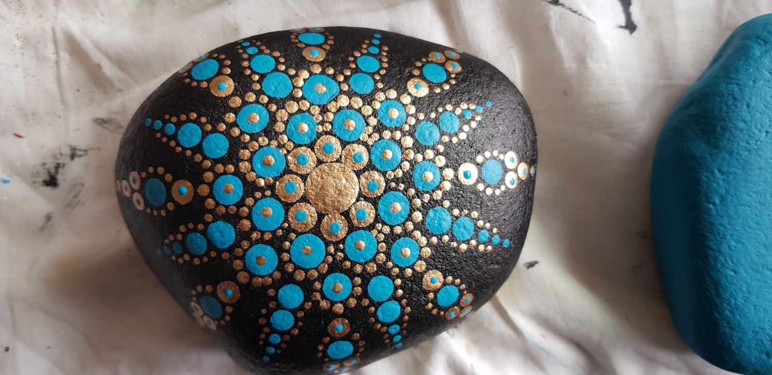 Blue and gold painted stone