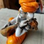 Karigaari India Karigaari Polyresine Ganesha Playing Instrument Orange Figurine