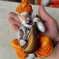 Karigaari India Karigaari Polyresine Ganesha Playing Instrument Orange Figurine