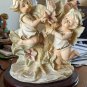 The Mirella Collection Angels Boy And Girl Surrounded By Flowers 10" Planter On