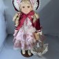 vintage victorian porcelain doll original clothing and umbrella.