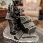 International Pewter Man Pilling Wood Logs Figurine