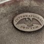 International Pewter Man Pilling Wood Logs Figurine