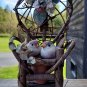 miniature wood garden chair with two birds on it