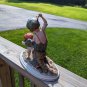 Vintage Girl Ridding Boy Signed Ceramic Figurine