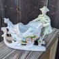 Vintage German Bisque Porcelain Figurine Vase Lady with Sleigh Sled Dragon