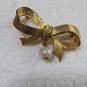 Vintage DUBARRY Gold Tone Ribbon With A Dangling Pearl