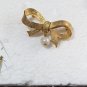 Vintage DUBARRY Gold Tone Ribbon With A Dangling Pearl