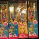 Lot of 4 brand new Barbie sealed in box 3 swimsuit 1 Barbie dress sealed