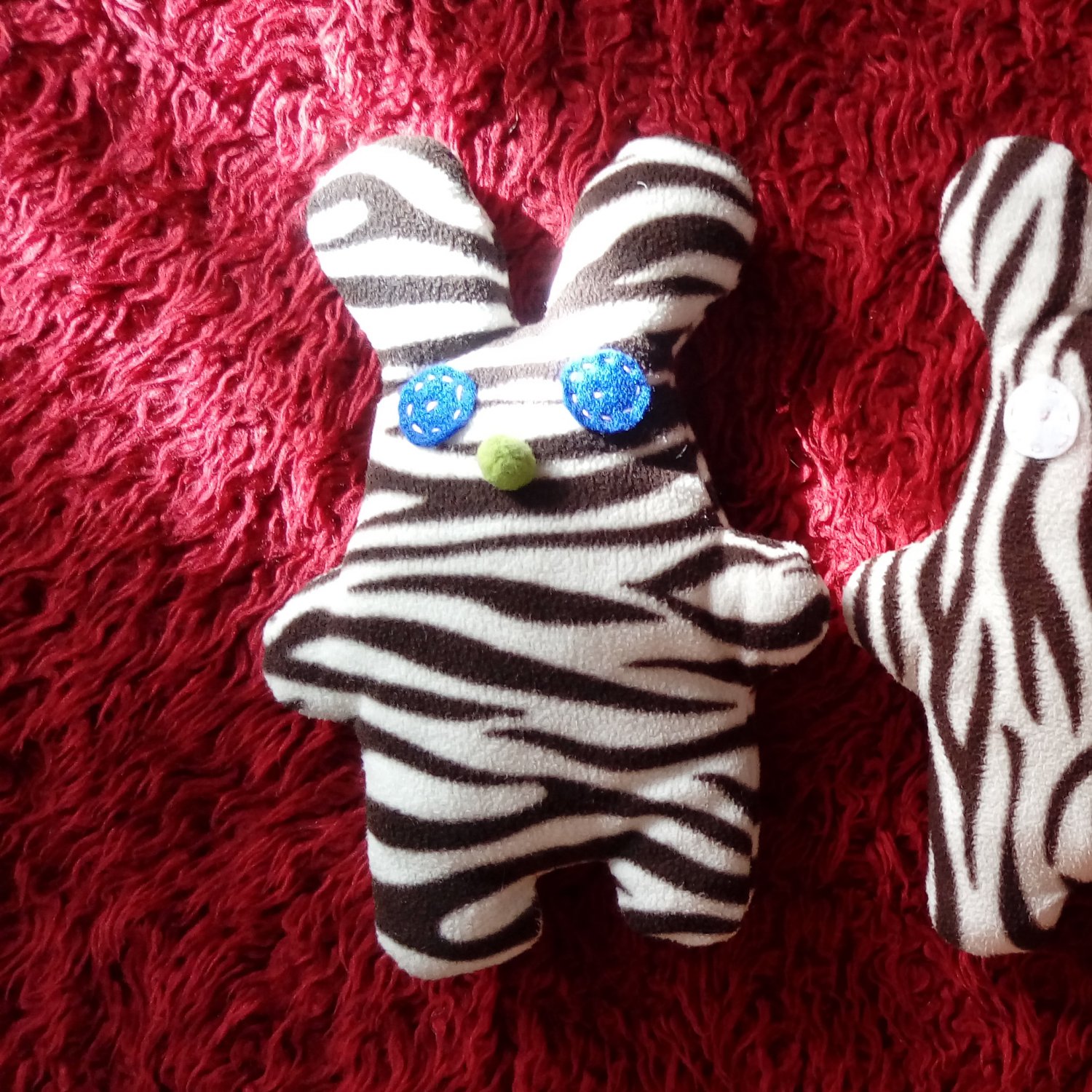 Cute handmade and uniquely designed stuffy bunny: zebra pattern,  blue eyes and green nose
