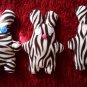 Zebra-pattern handmade and uniquely designed stuffy bunny: white eyes and pink nose