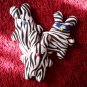 Zebra-pattern handmade and uniquely designed stuffy bunny: light pink eyes and light blue nose