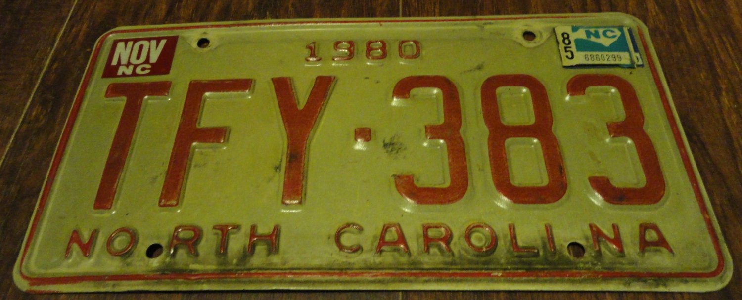 1980 TFY 383 North Carolina license plate with November 1985 stickers