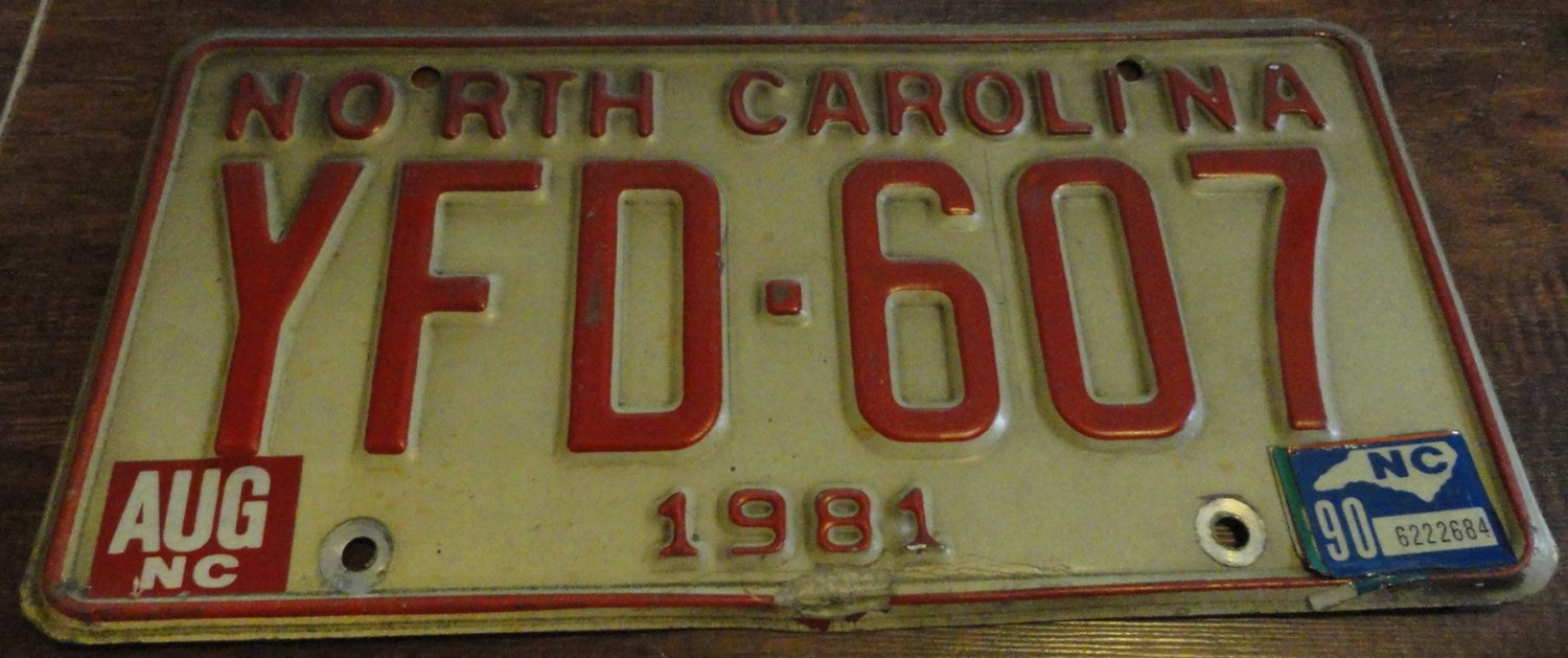 1981 YFD 607 North Carolina license plate with August 1990 stickers