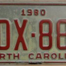 1980 North Carolina license plate TDX 880 with June 1986 stickers