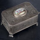 Decor Art. Silver music box with a singing bird