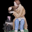 Decor Art Figurine A man with a hunk of bread.