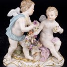 Decor Art. Germany. Meissen Sculpture. Two cupids with a garland of flowers.