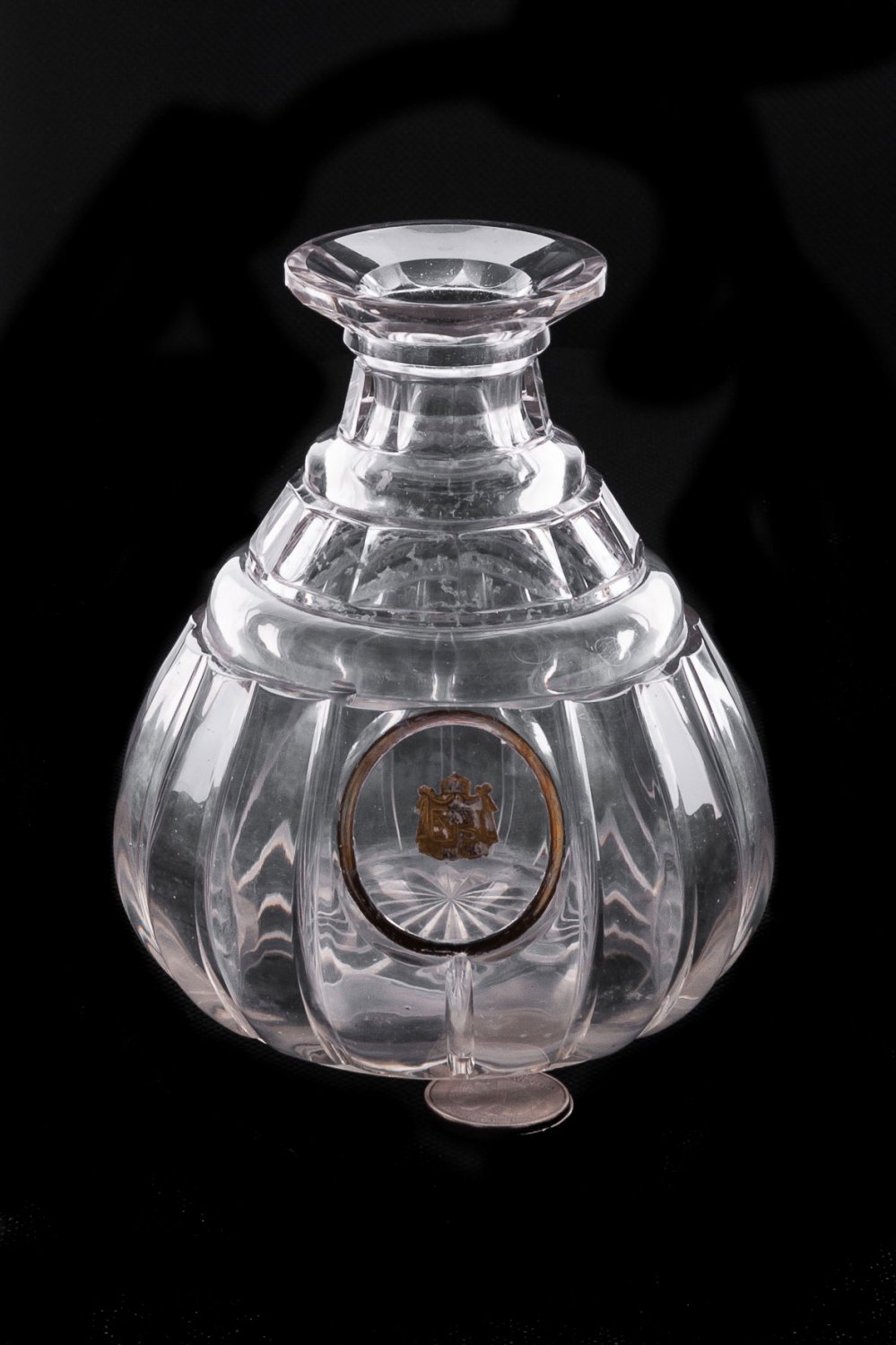 Decanter with the family coat of arms.