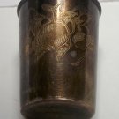 A silver stack with an engraving in the form of berries on a branch. A silver stack with an engraving in the form of berries on a branch.