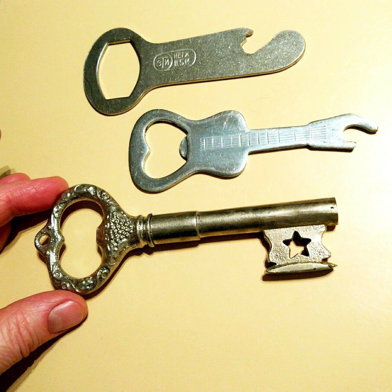Three old bottle openers USSR