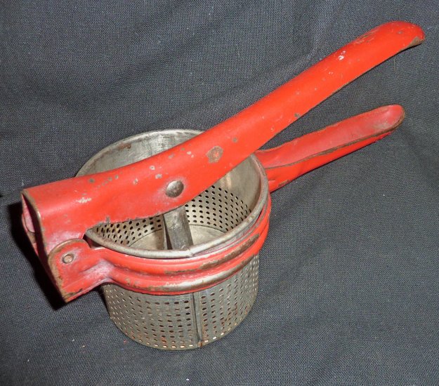 Vintage antique kitchen tool potato ricer masher press