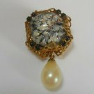 Gold-tone filigree brooch with Large Center Folied Stone & Faux Pearl Charm