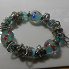 Silver-tone and Blue Floral Art Glass Heart Stretch Bracelet