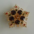 Star/Snowflake Design filigree brooch with multi color faceted stones