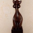 Woman' torso. Wood sculpture, signed.